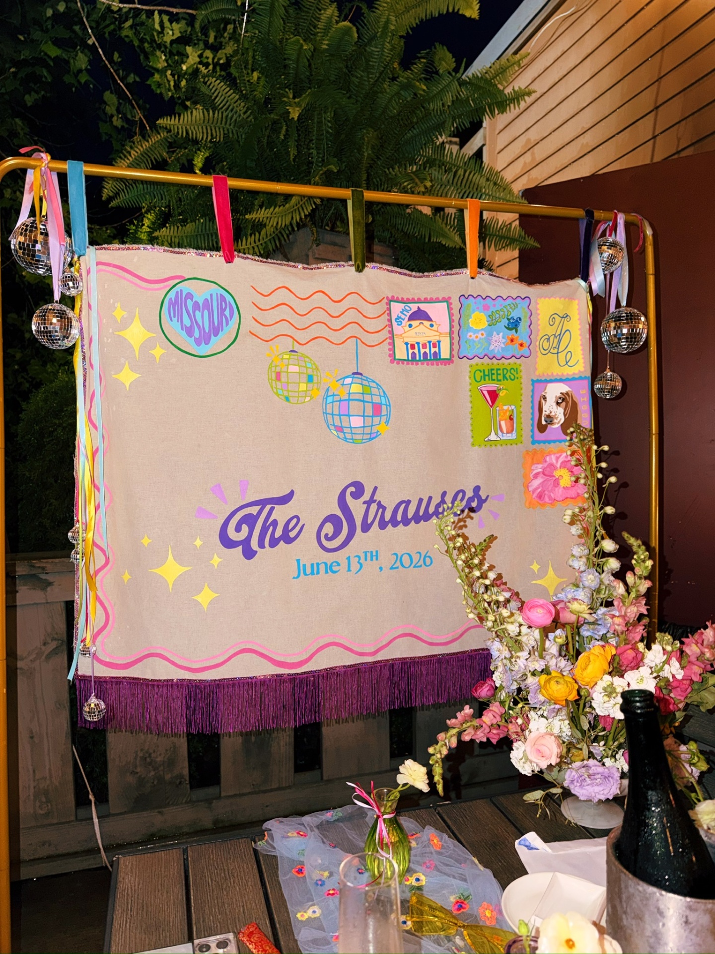 Custom painted Strauss backdrop with disco balls and floral accents