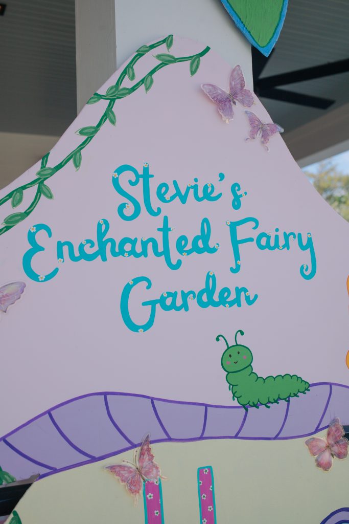 Enchanted fairy garden hand-lettered signage with butterfly details