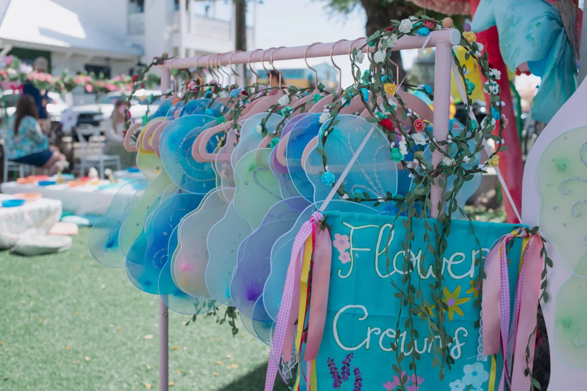 Flower crowns and fairy wings display at a children's party