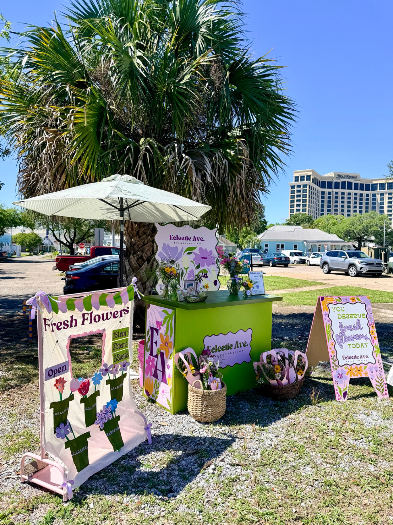 Eclectic Ave. pop-up flower stand under a palm tree on the Gulf Coast