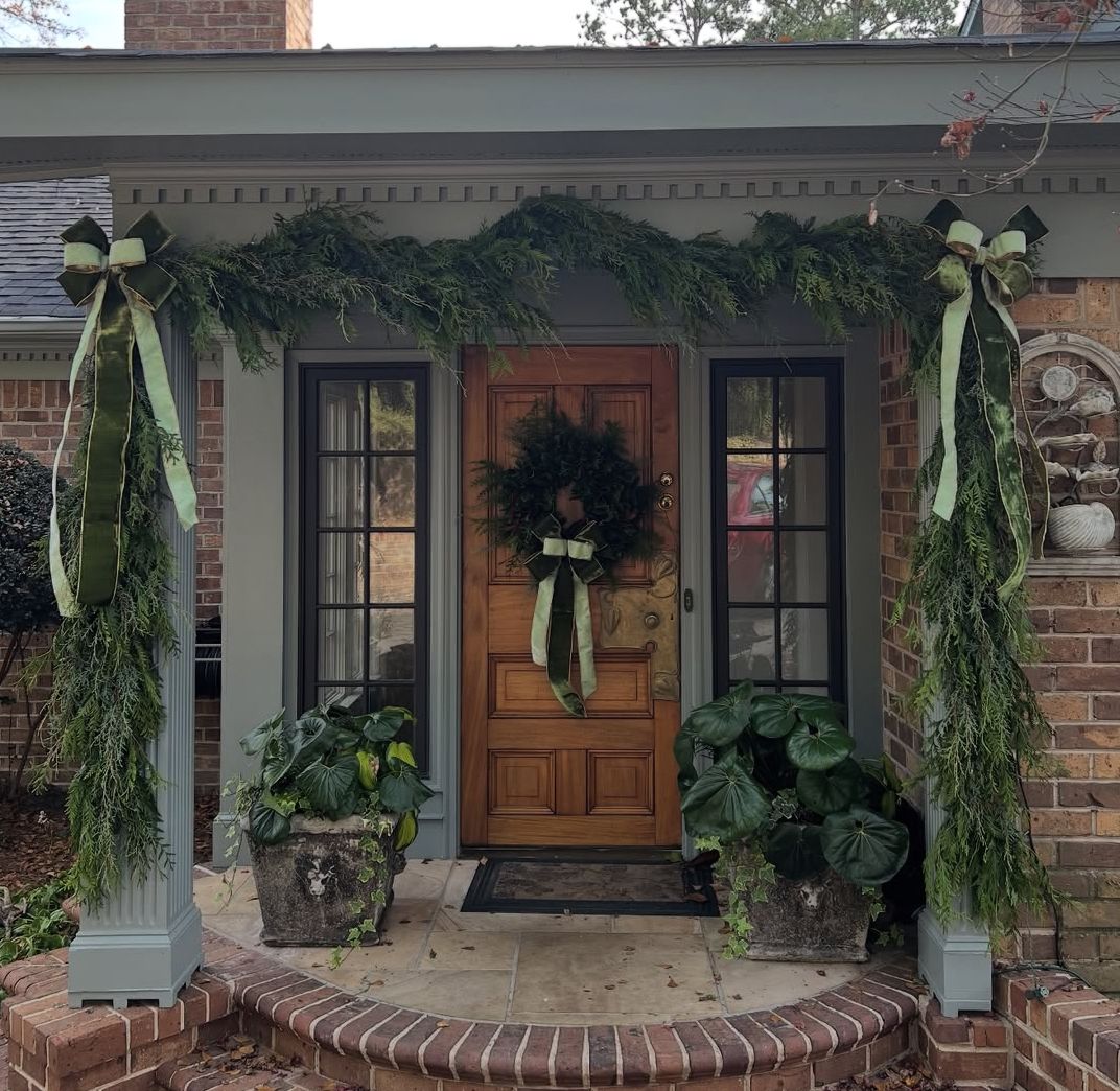 Fall porch styled with heirloom pumpkins, mums and dried hydrangea