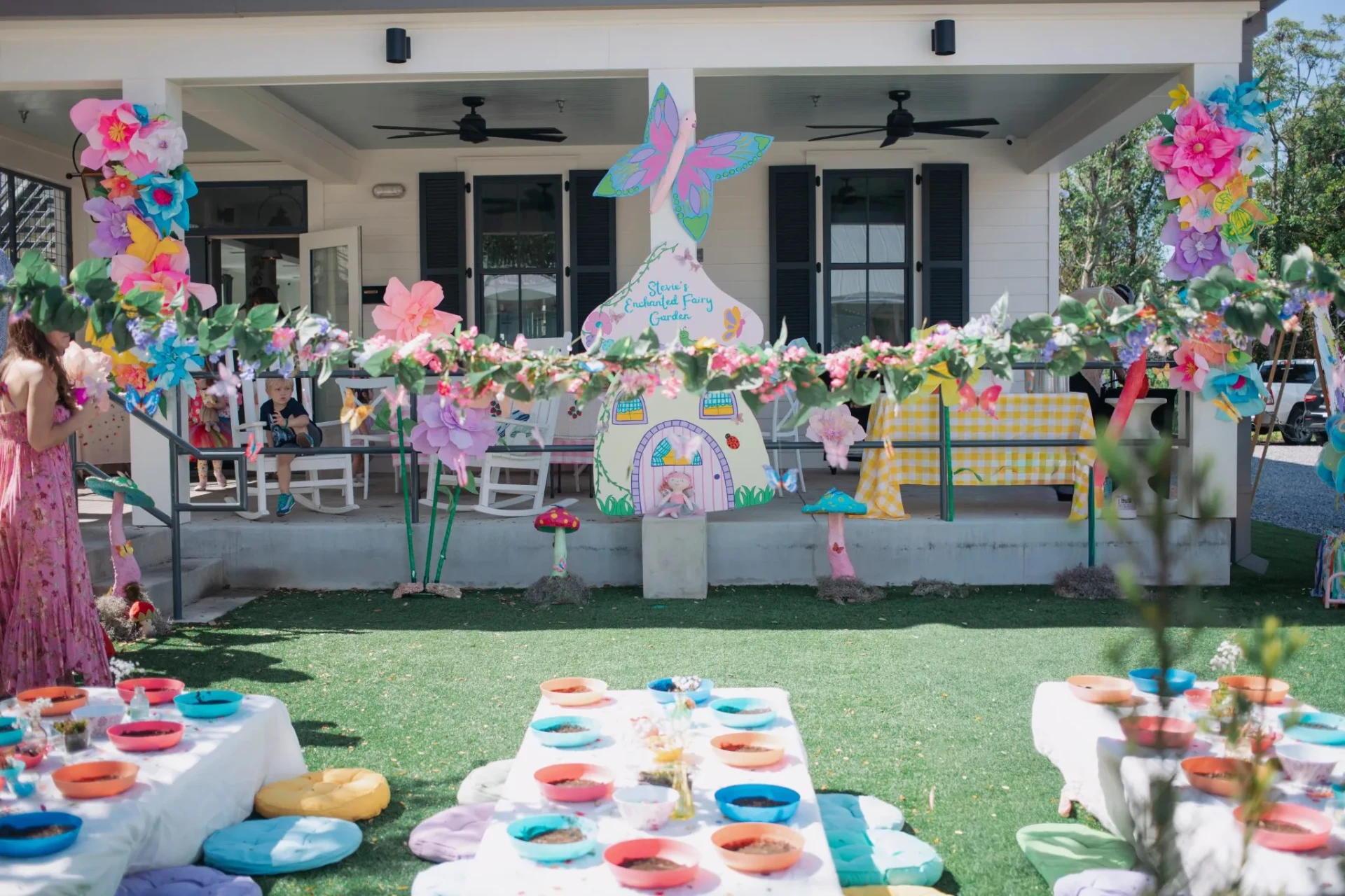 Enchanted fairy garden birthday party with paper flowers and porch installation